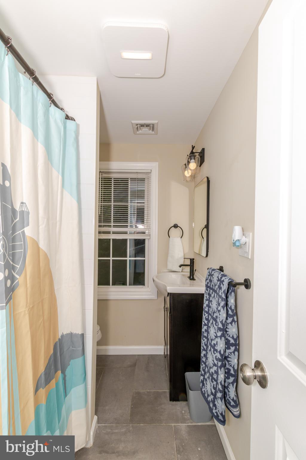 100 North 1st Road Hammonton, NJ 08037 - Photo 41 of 47 a bathroom with a bathtub sink and mirror