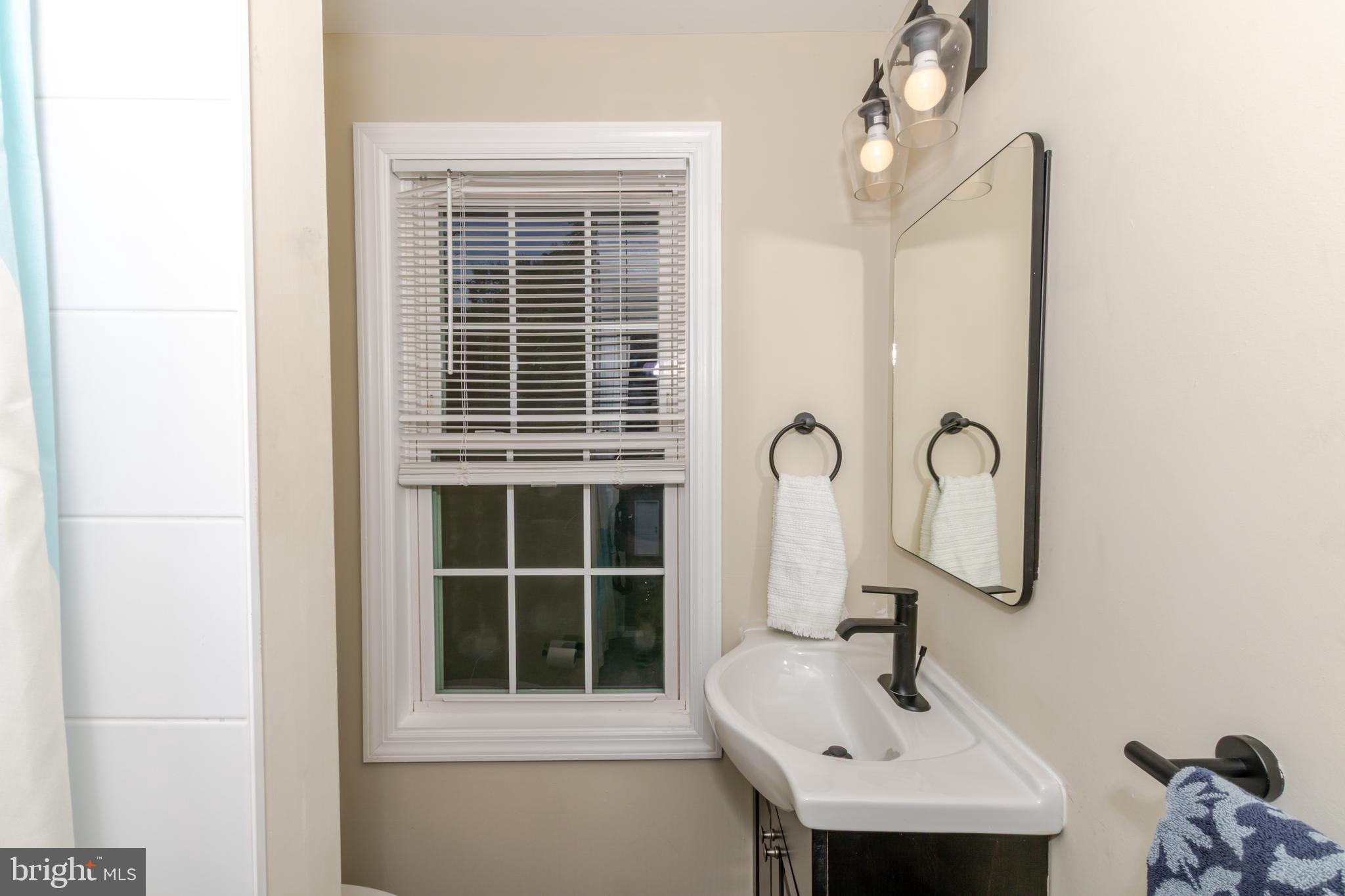 100 North 1st Road Hammonton, NJ 08037 - Photo 42 of 47 a bathroom with a sink and a mirror