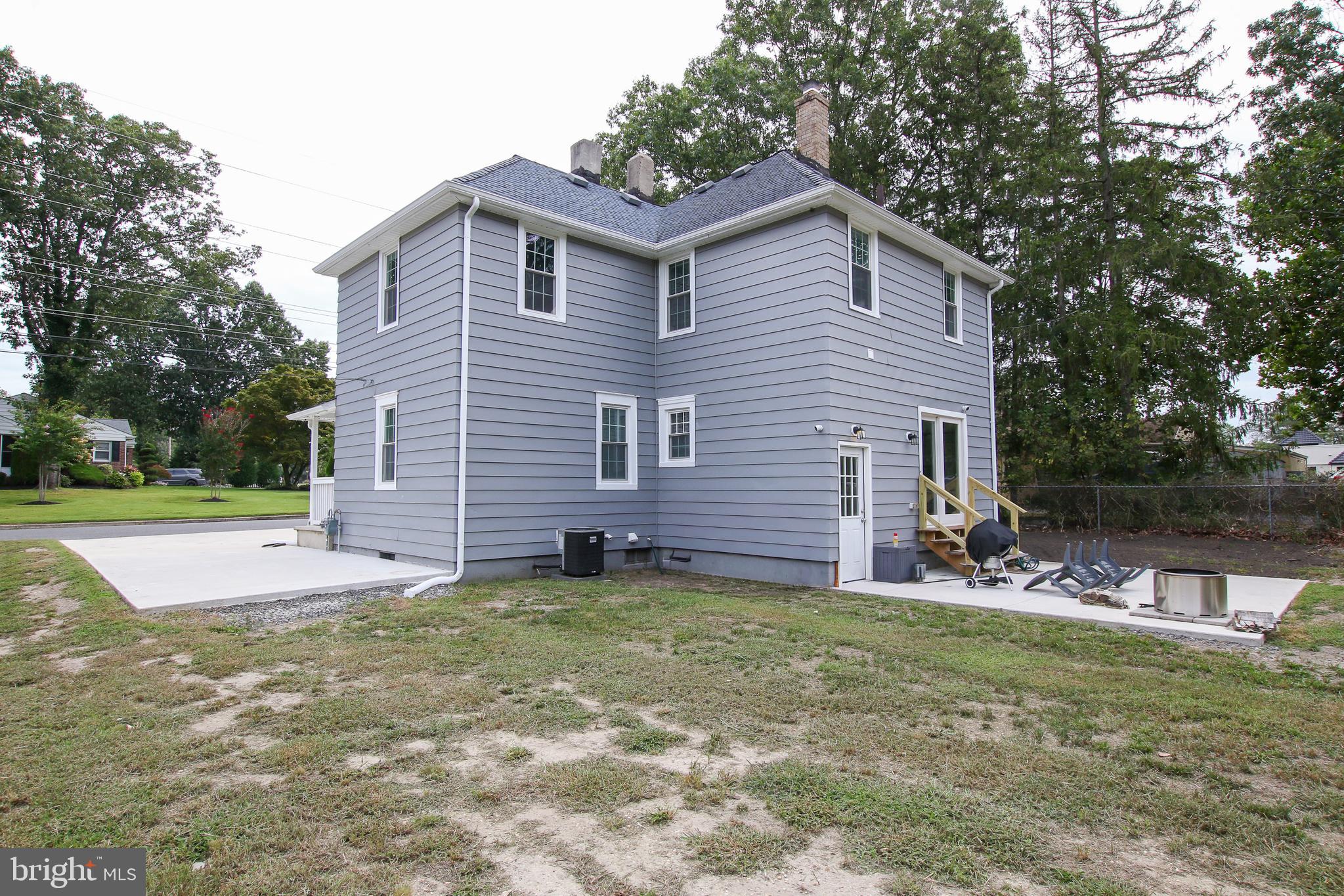 100 North 1st Road Hammonton, NJ 08037 - Photo 47 of 47 a view of a house with a yard and lawn chairs with a fire pit