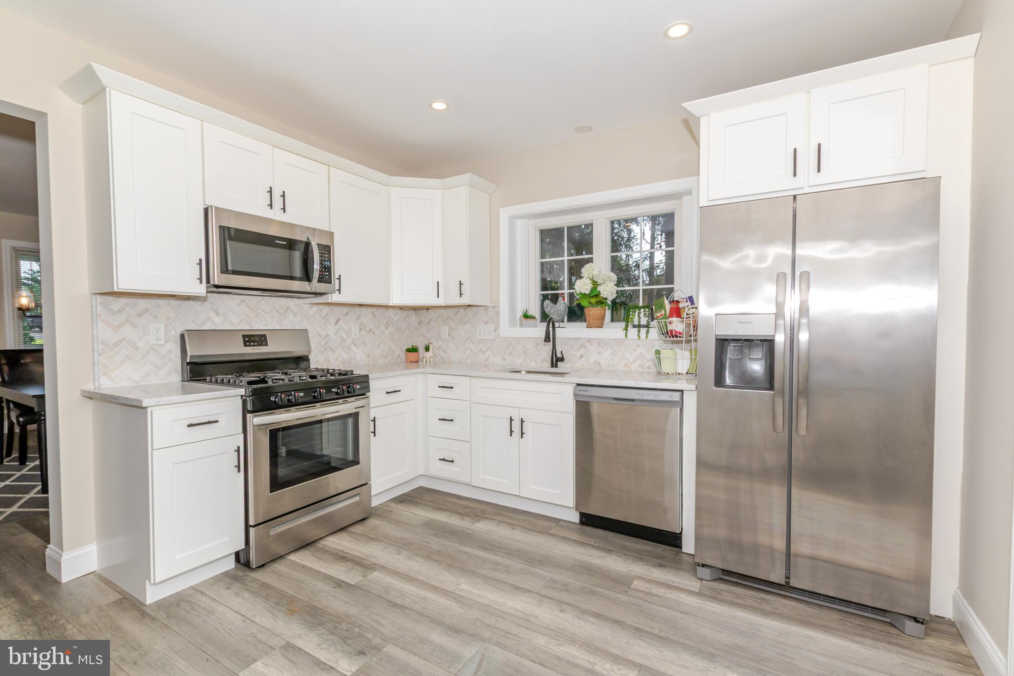 100 North 1st Road Hammonton, NJ 08037 - Photo 8 of 47 a kitchen with a refrigerator stove and microwave