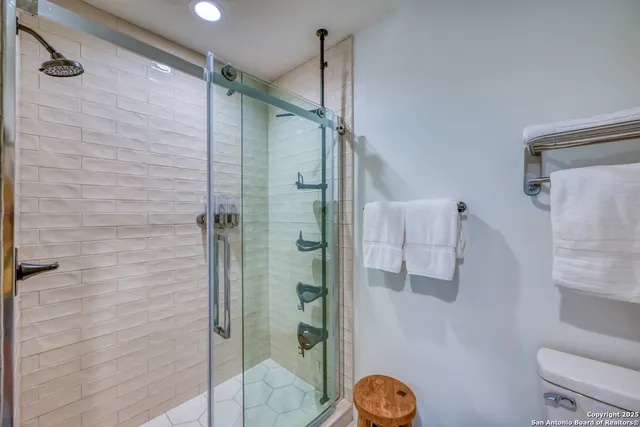 an aerial view of a house with garden space and street view