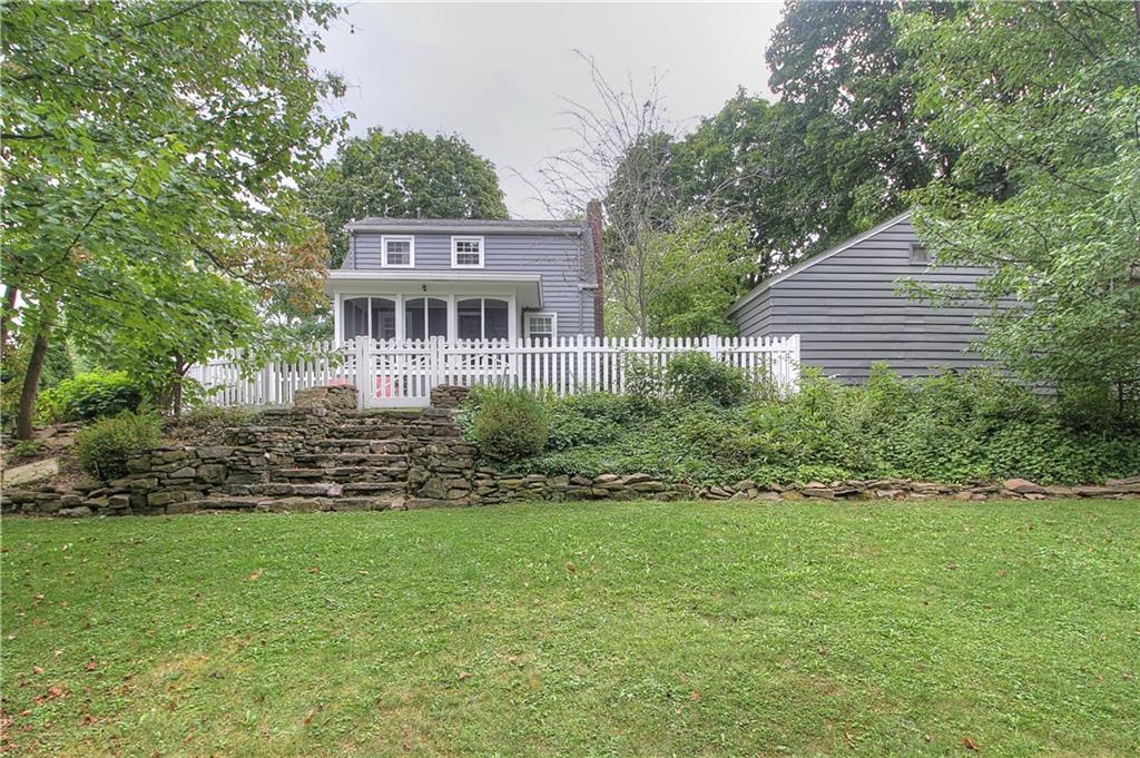 140 Oakville Road Beaver Falls, PA 15010 - Photo 20 of 25 New vinyl fencing on the upper tier, natural stone wall and stairs add to the charm.