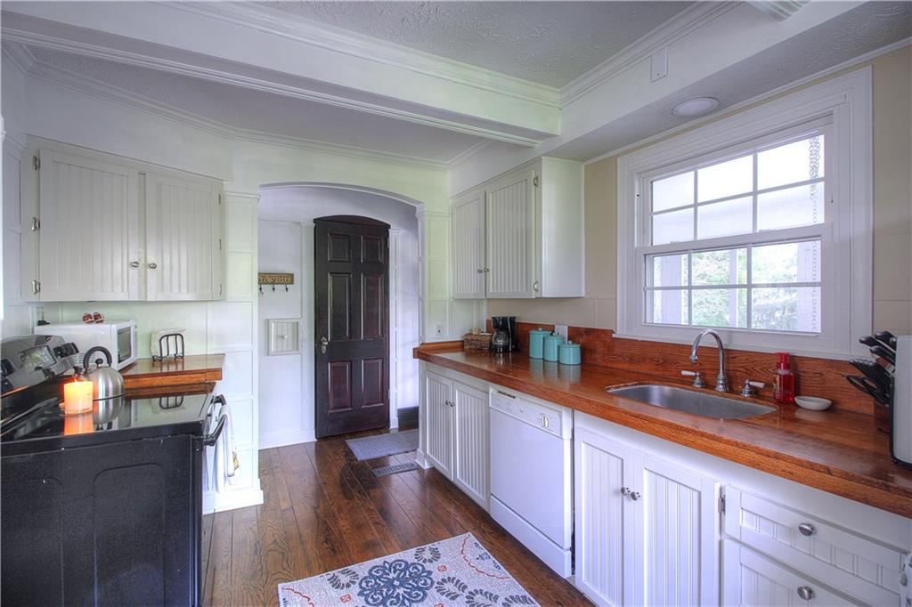 140 Oakville Road Beaver Falls, PA 15010 - Photo 6 of 25 Coffered ceiling, custom counter from an oak tree on the property, shaker style cabinetry, LED canned lighting.....