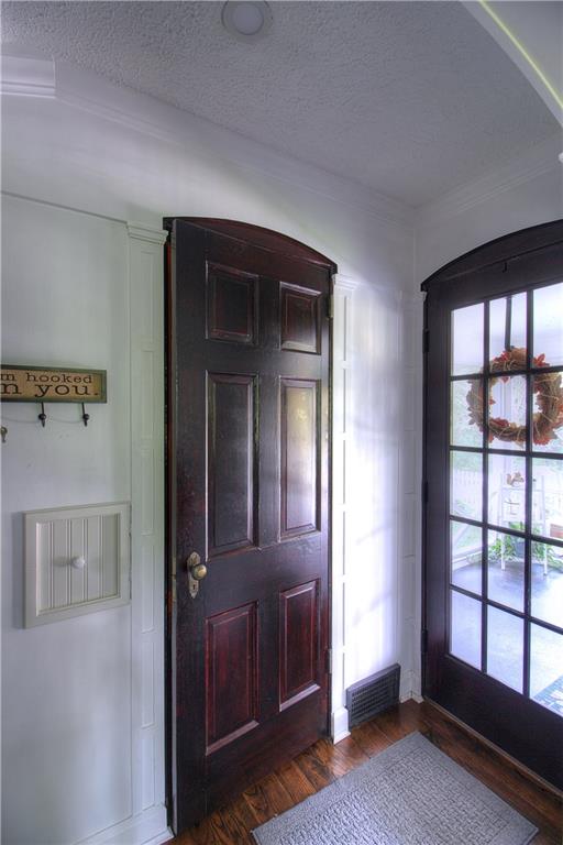 140 Oakville Road Beaver Falls, PA 15010 - Photo 7 of 25 This home is rich in custom details.....Arches atop the 6-panel doors, 15-glass lite panels provide the view to the back porch and yard....