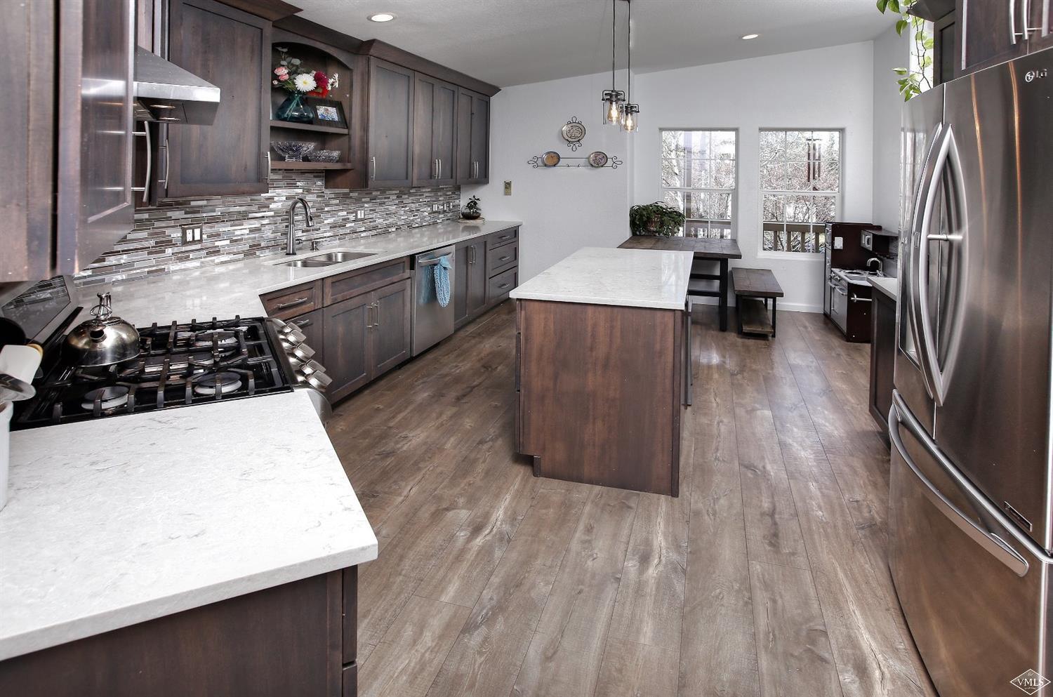 134 Ringneck Eagle, CO 81631 - Photo 11 of 25 a kitchen with stainless steel appliances a stove a refrigerator and a stove