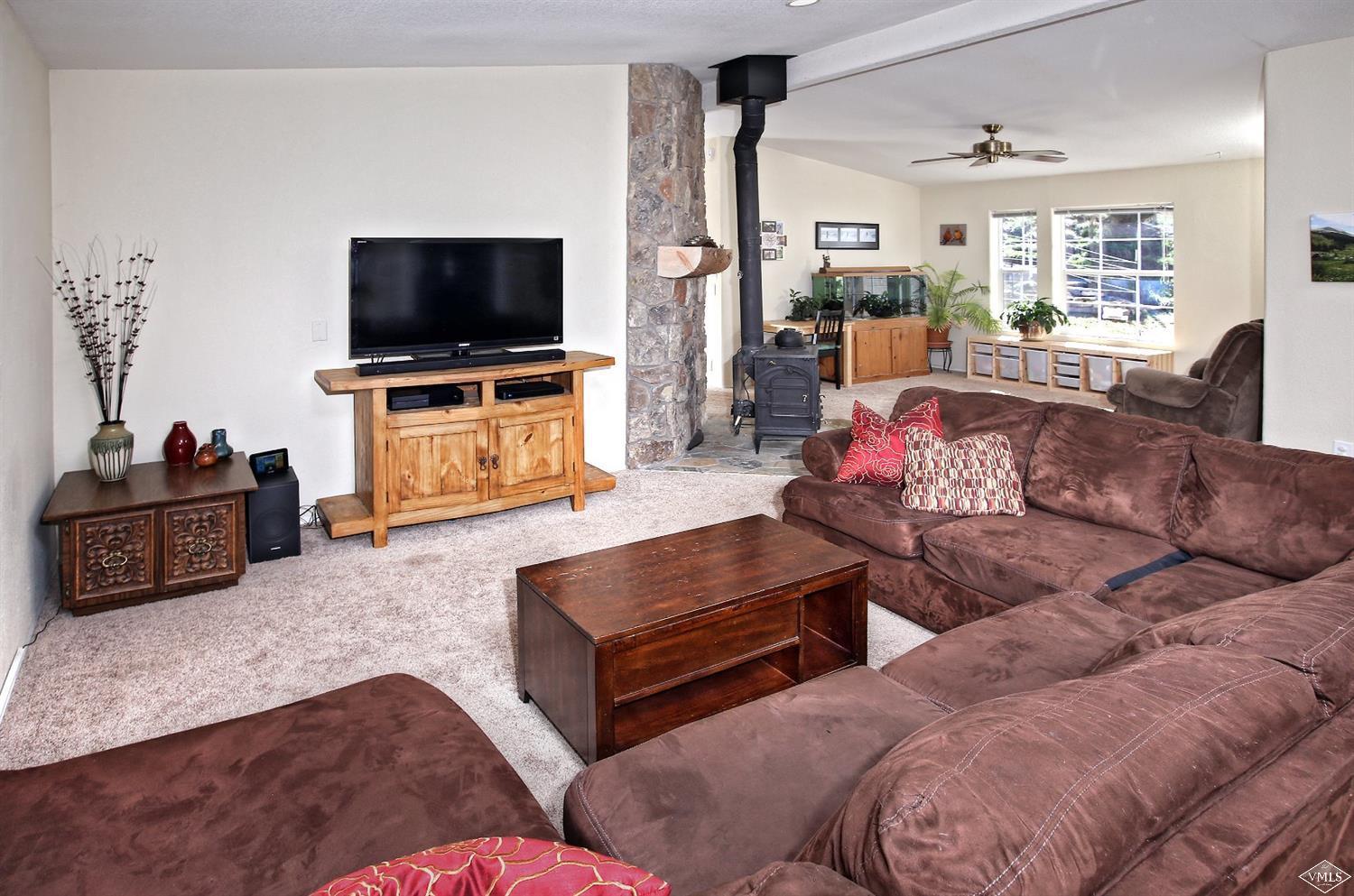 134 Ringneck Eagle, CO 81631 - Photo 14 of 25 a living room with furniture and a flat screen tv