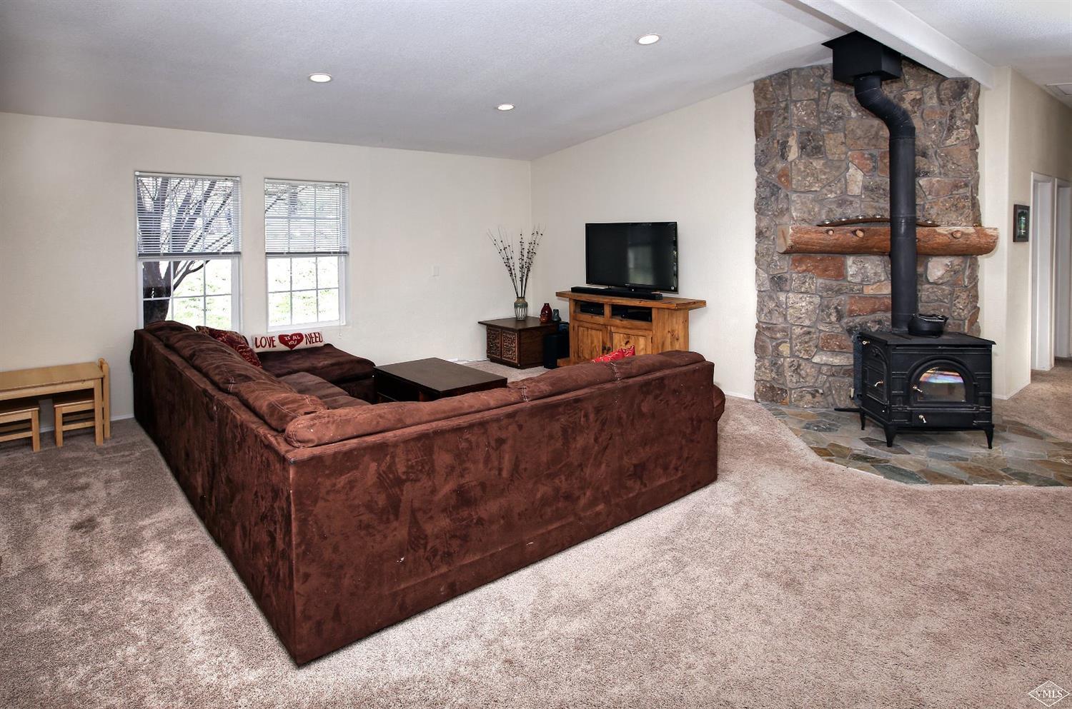 134 Ringneck Eagle, CO 81631 - Photo 15 of 25 a living room with furniture a flat screen tv and a large window