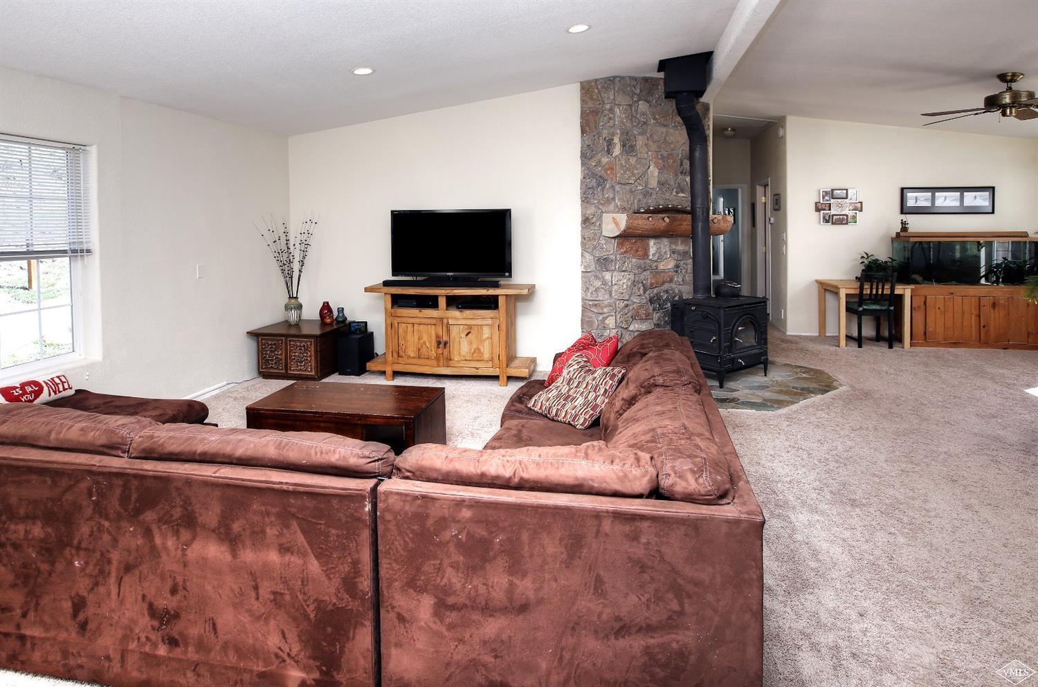 134 Ringneck Eagle, CO 81631 - Photo 17 of 25 a living room with furniture and a flat screen tv