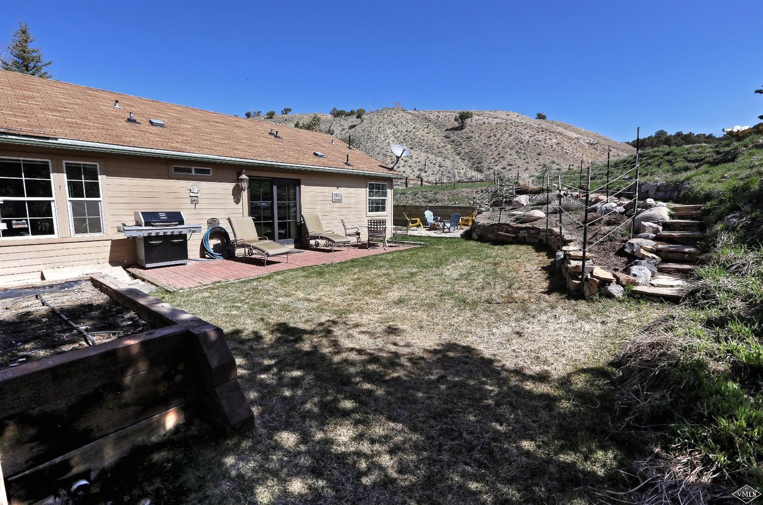 134 Ringneck Eagle, CO 81631 - Photo 2 of 25 a view of a house with backyard sitting area and tub