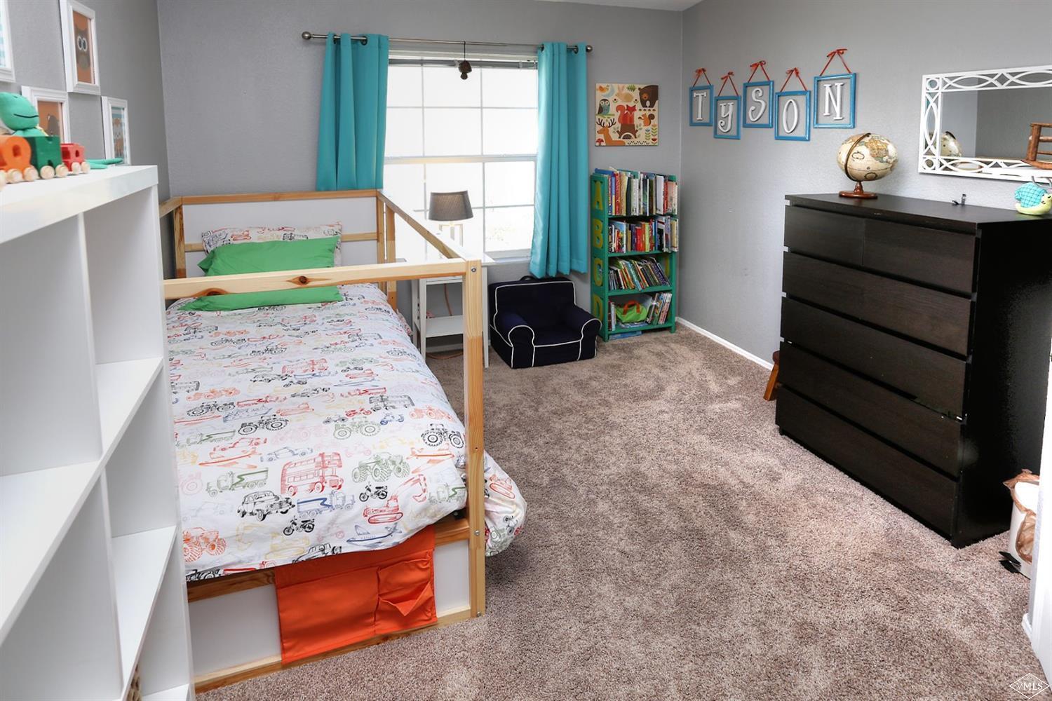 134 Ringneck Eagle, CO 81631 - Photo 22 of 25 a living room with furniture and a wooden floor