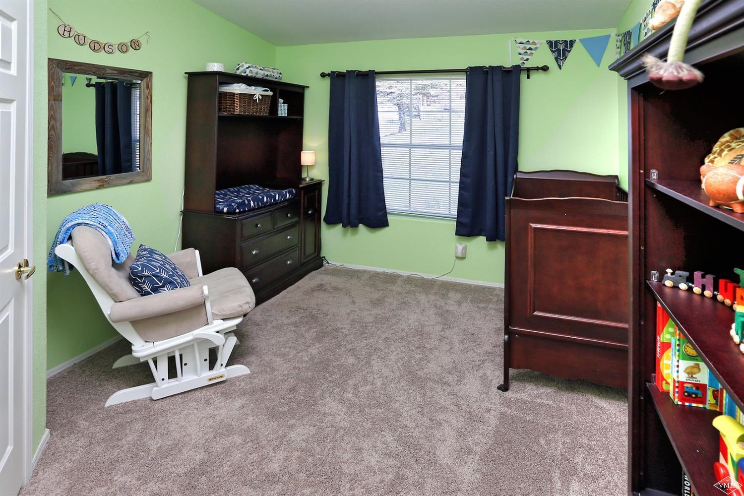 134 Ringneck Eagle, CO 81631 - Photo 23 of 25 a living room with furniture and a flat screen tv