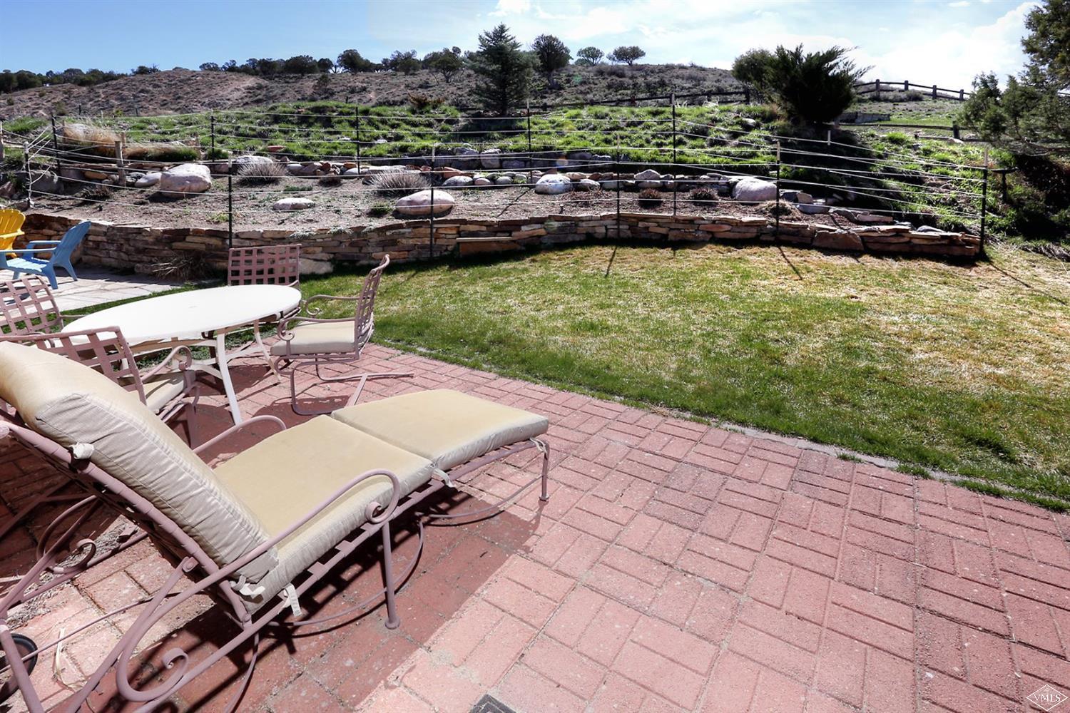 134 Ringneck Eagle, CO 81631 - Photo 4 of 25 a view of a chairs and table on the terrace