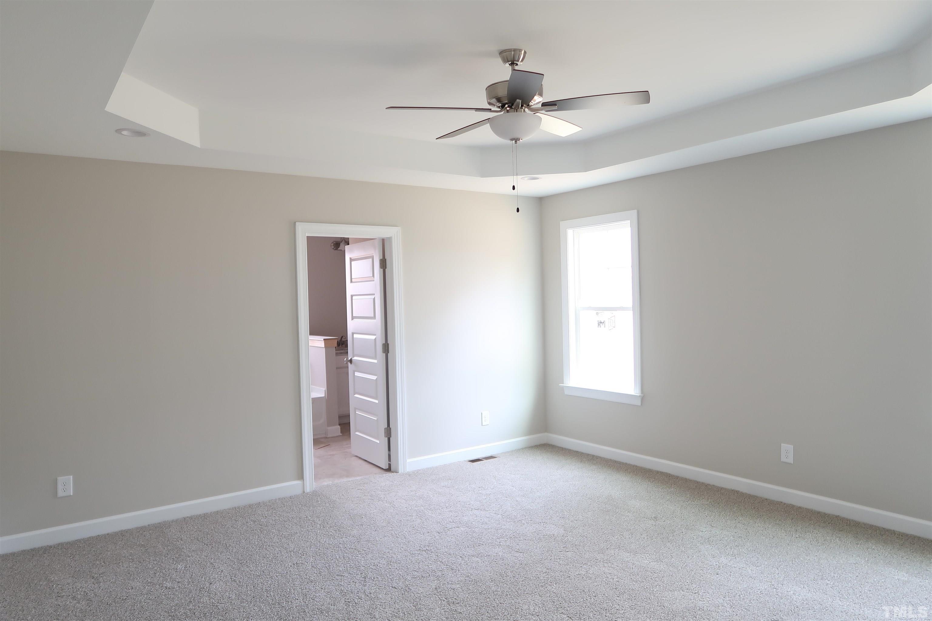 1191 Denning Road Angier, NC 27501 - Photo 11 of 25 a view of an empty room with a window