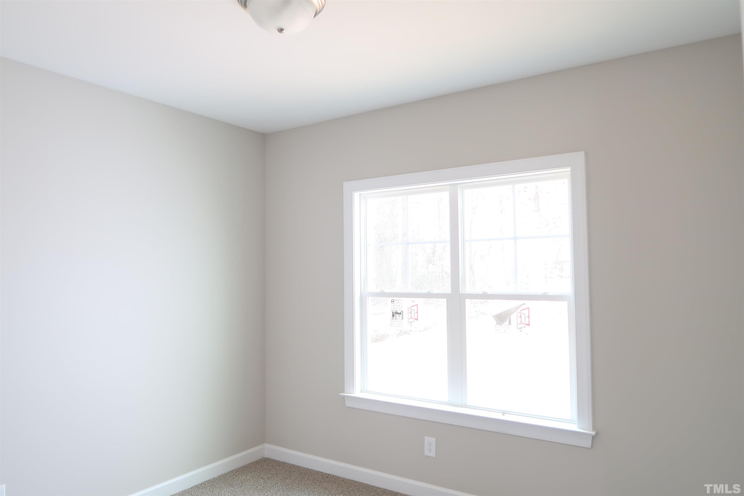 1191 Denning Road Angier, NC 27501 - Photo 14 of 25 a view of an empty room with a window