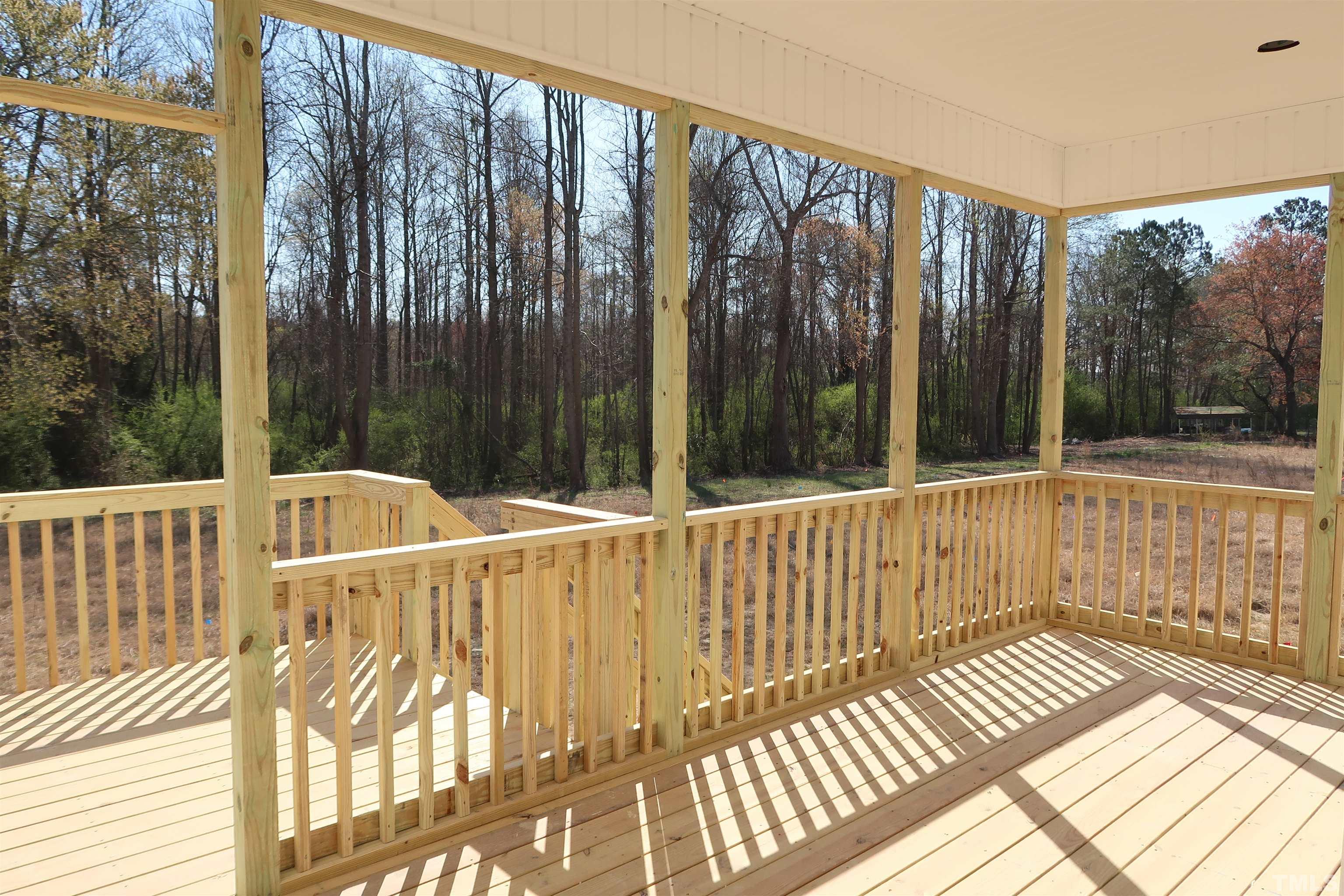 1191 Denning Road Angier, NC 27501 - Photo 17 of 25 a view of balcony with floor to ceiling windows with wooden floor