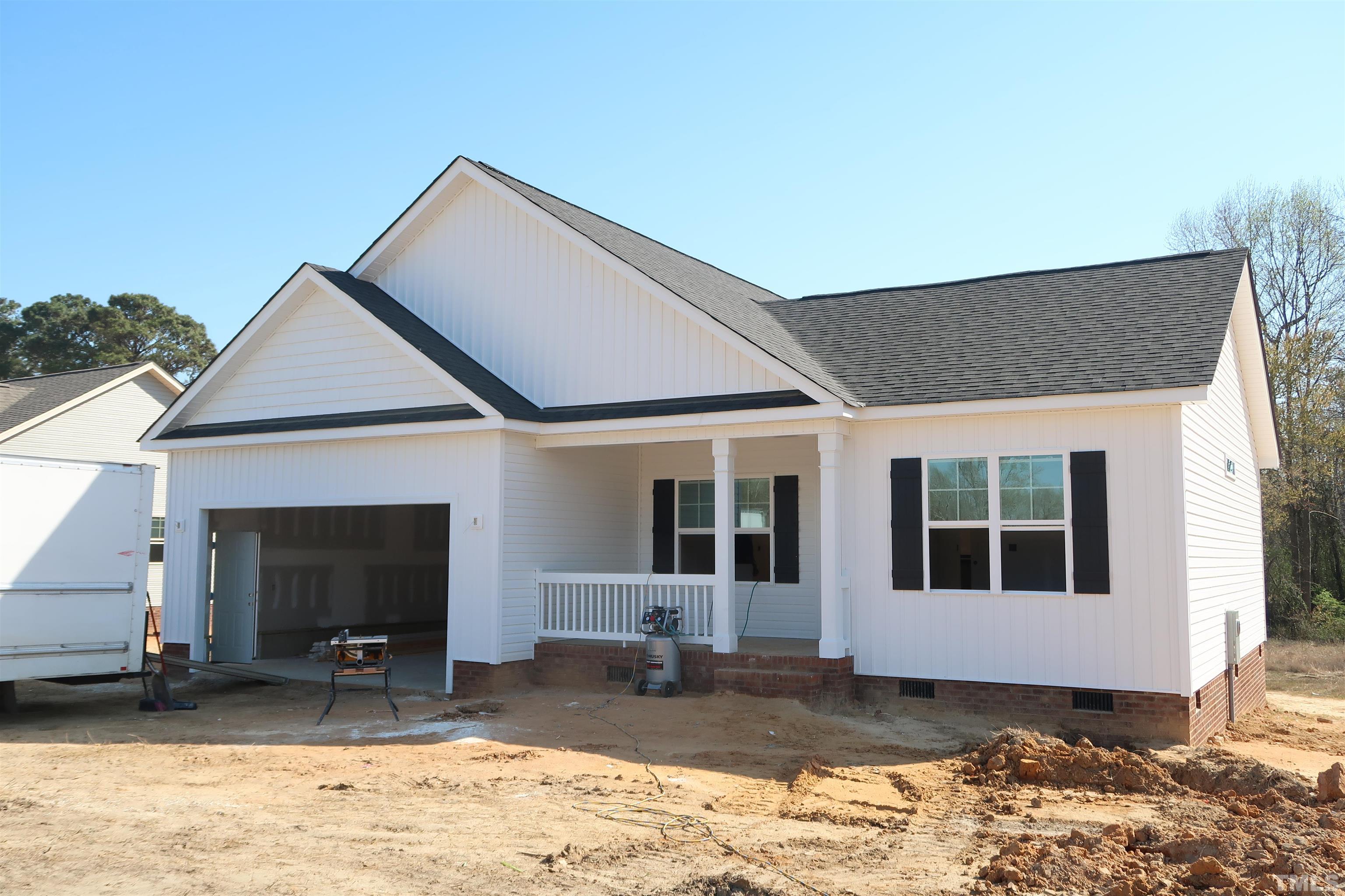1191 Denning Road Angier, NC 27501 - Photo 2 of 25 a front view of a house with a yard