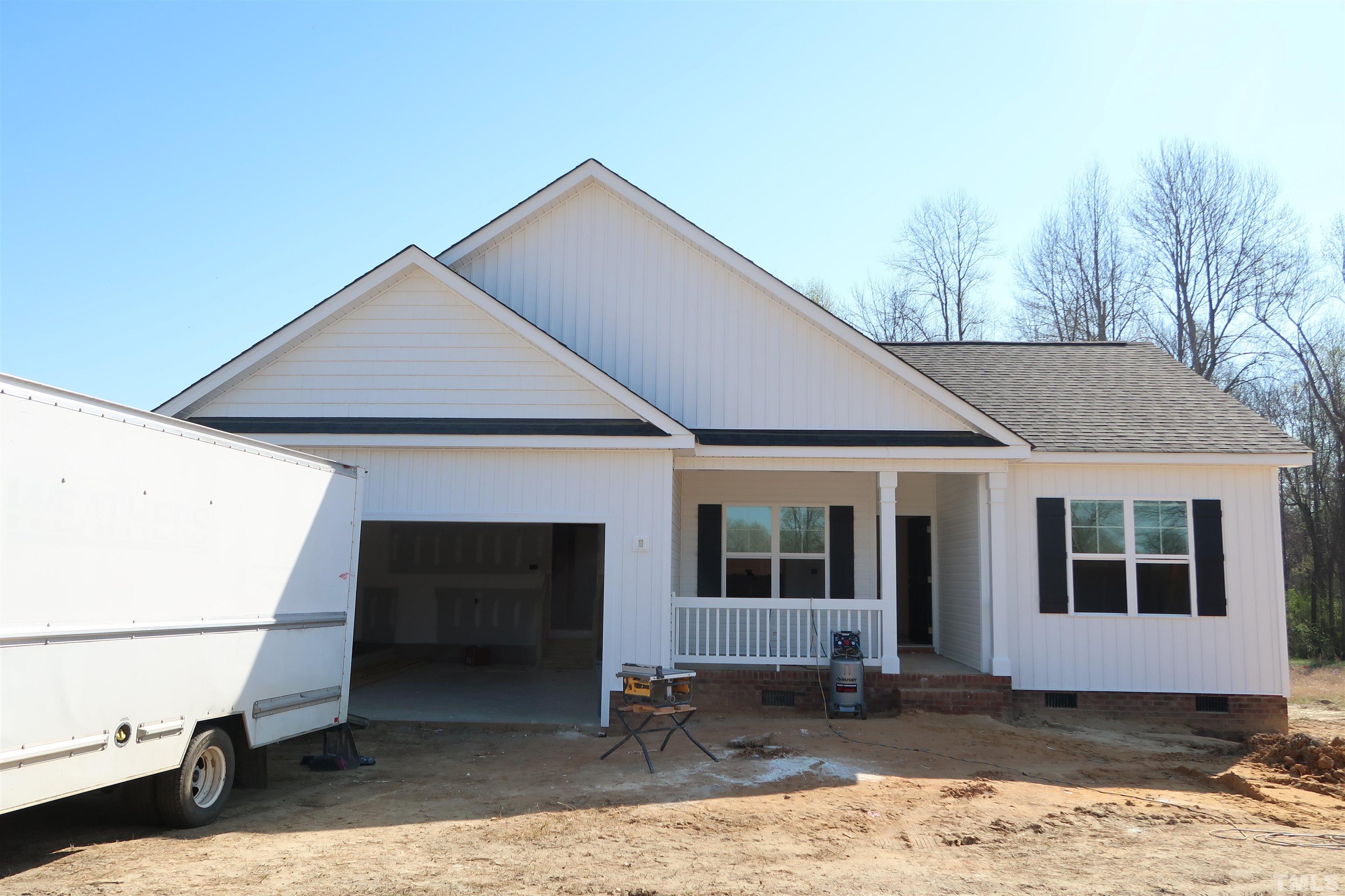 1191 Denning Road Angier, NC 27501 - Photo 3 of 25 a front view of a house with a garage
