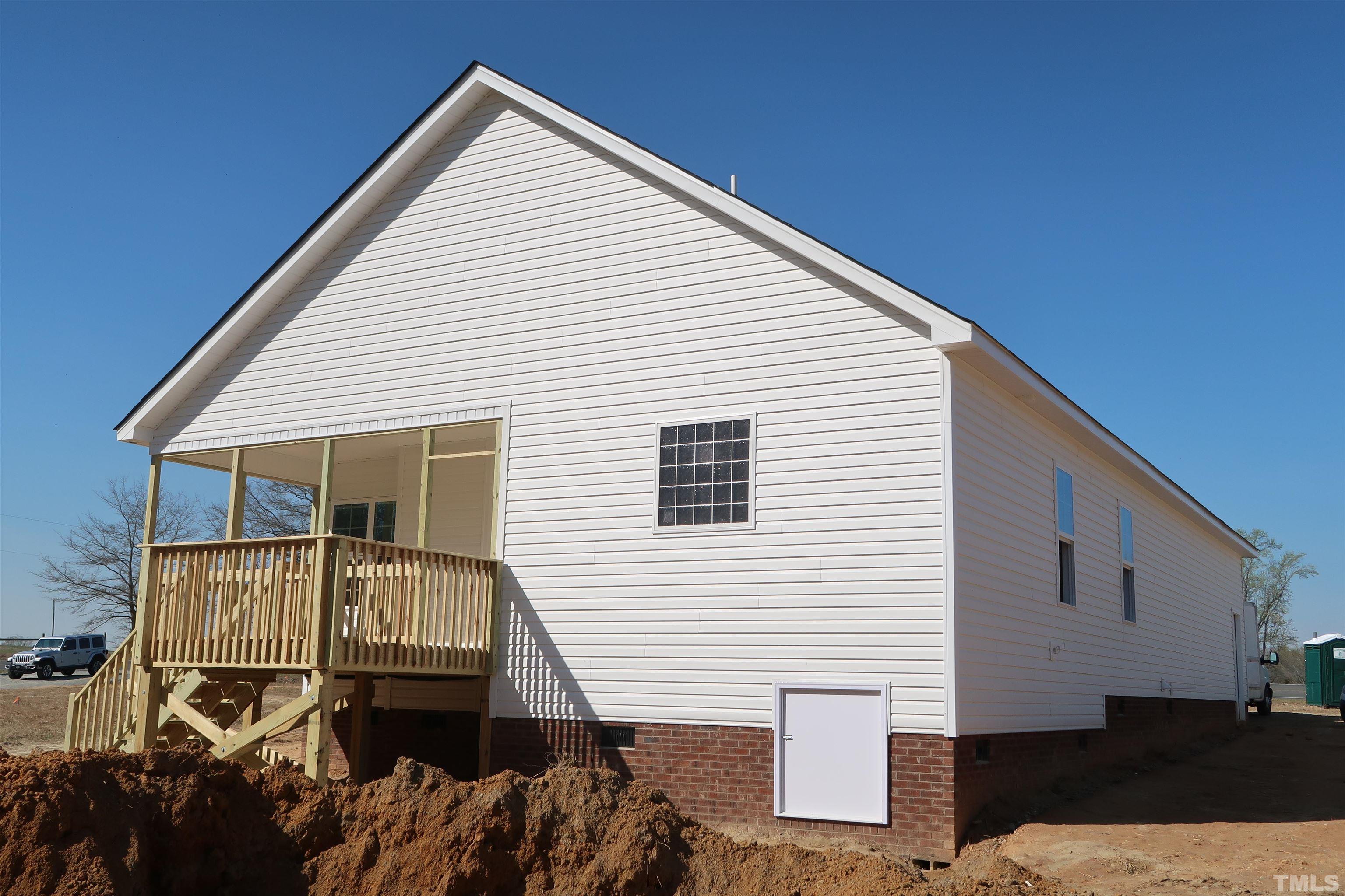 1191 Denning Road Angier, NC 27501 - Photo 5 of 25 a view of house with backyard and deck