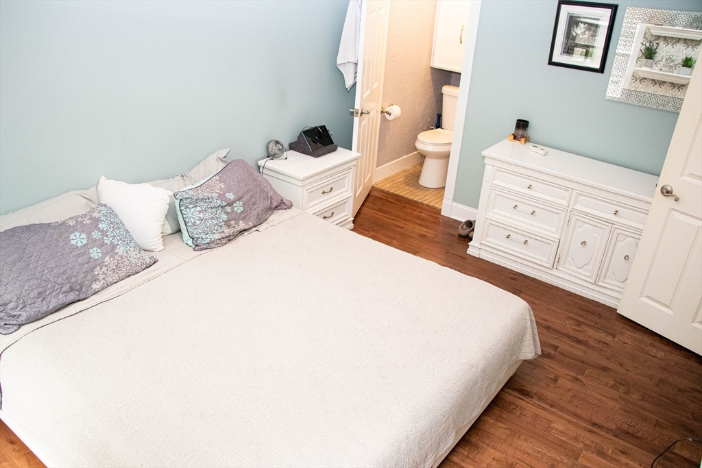 85-87 Slater Street Webster, MA 01570 - Photo 32 of 41 a spacious bedroom with a bed and a cabinets