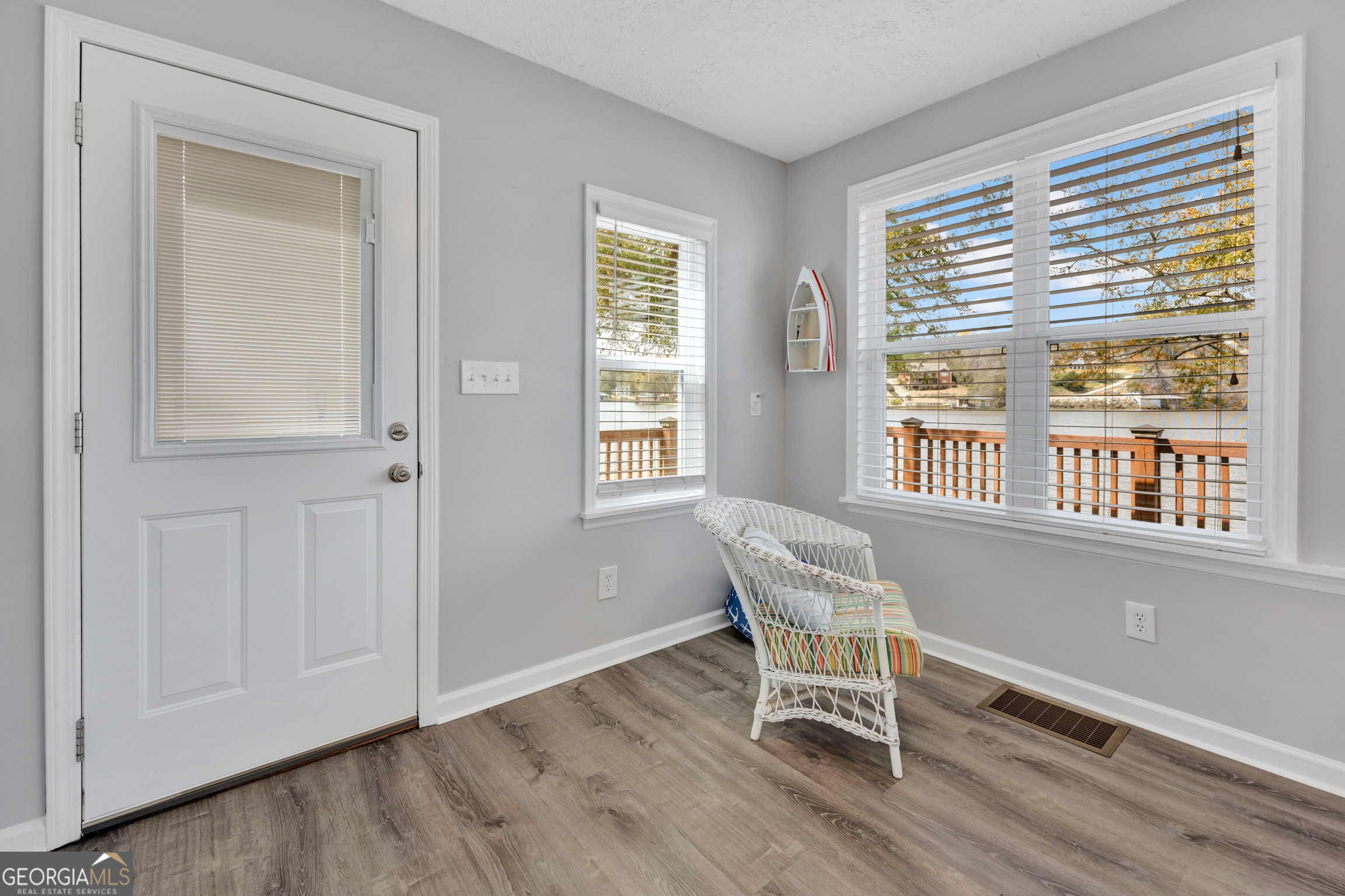 411 Alcovy Road Mansfield, GA 30055 - Photo 12 of 49 a workspace room with wooden floor and windows