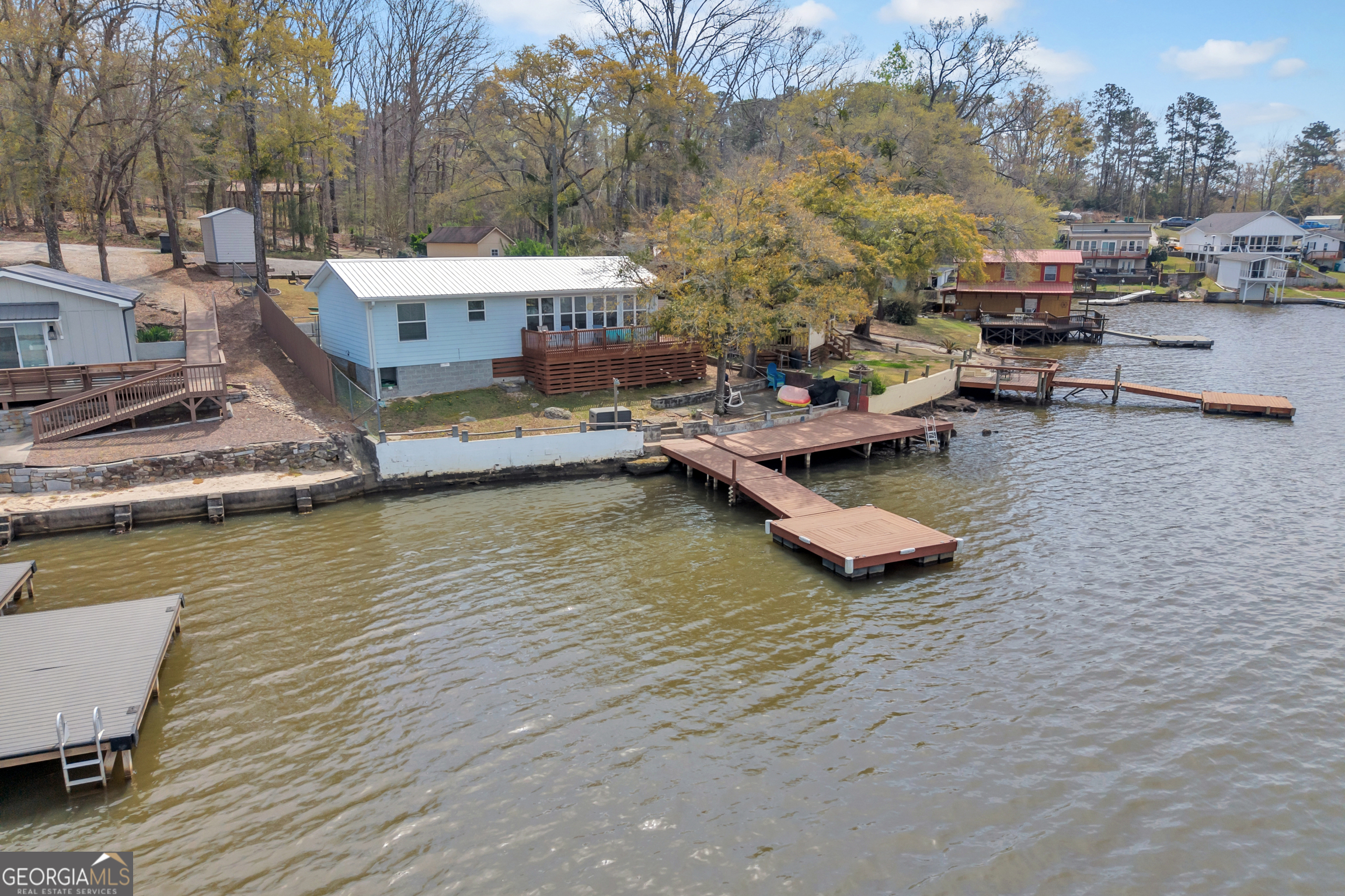 411 Alcovy Road Mansfield, GA 30055 - Photo 44 of 49 a view of a lake with a house