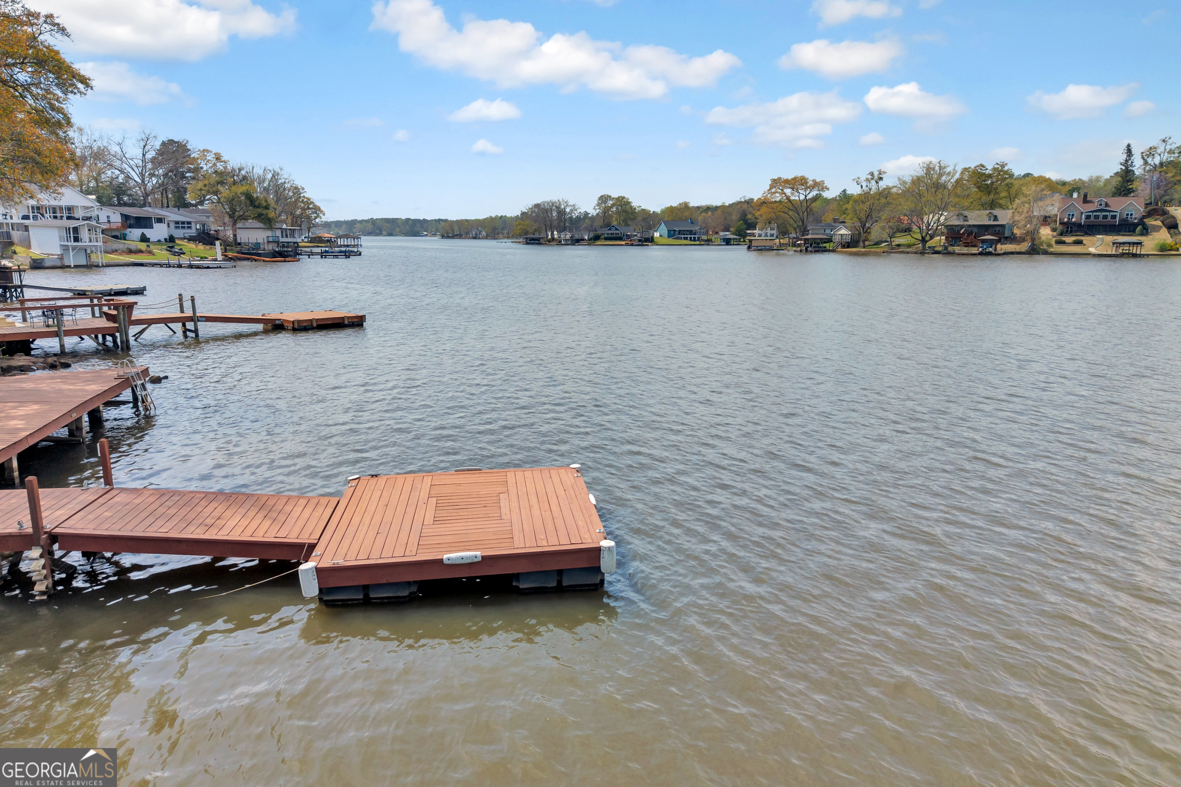 411 Alcovy Road Mansfield, GA 30055 - Photo 45 of 49 a view of a lake with houses in the back