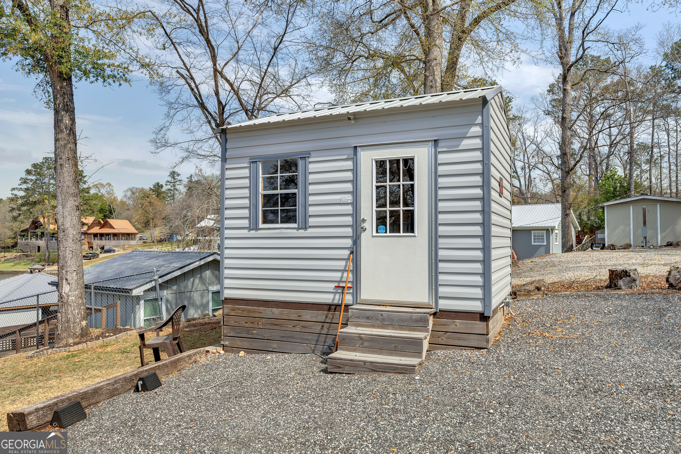 411 Alcovy Road Mansfield, GA 30055 - Photo 49 of 49 a view of a house with a yard and wooden fence