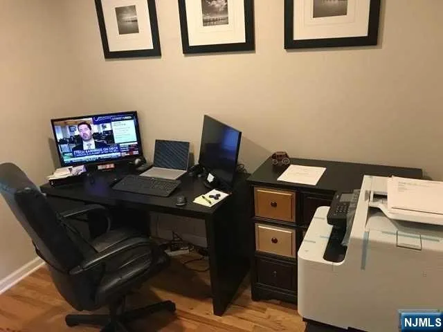a laptop computer sitting on top of a desk