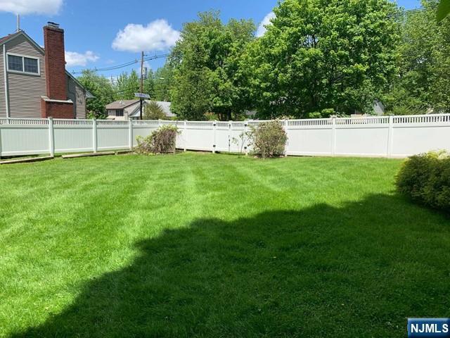 116 Prospect Street Paramus, NJ 07652 - Photo 17 of 17 a view of a backyard with grass and a large tree