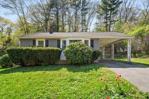 front view of a house with a yard