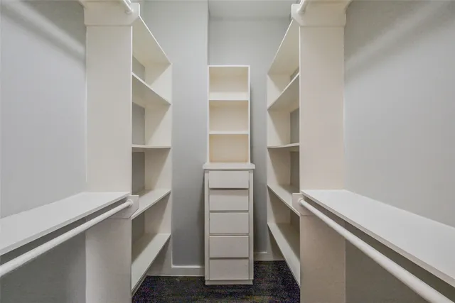 a view of an empty walk in closet