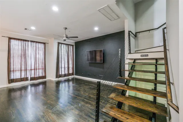 a view of entryway with stairs and wooden floor