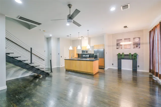 a view of kitchen with cabinets and wooden floor
