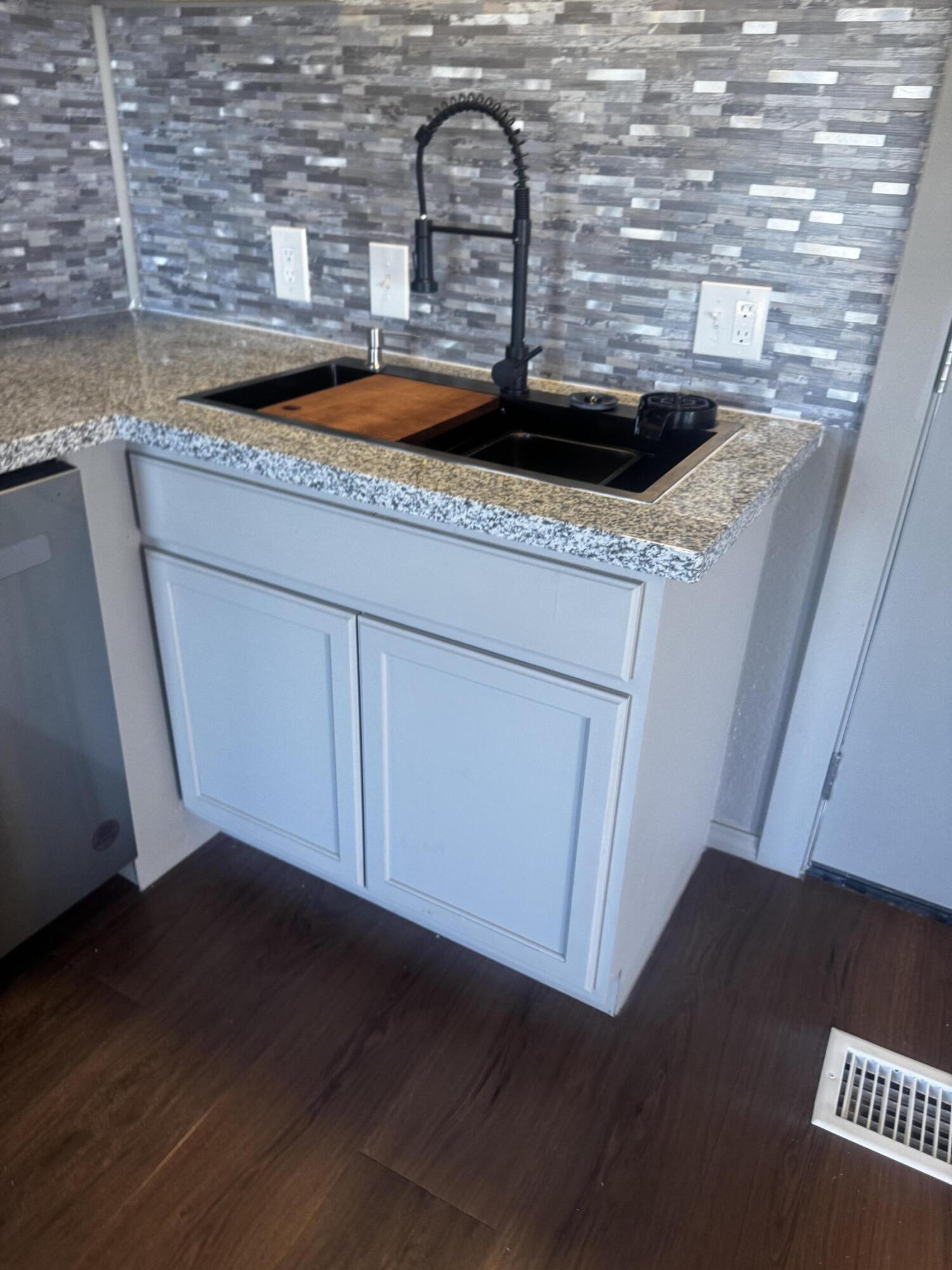 1128 Alaska Road Levelland, TX 79336 - Photo 9 of 20 a view of a kitchen with a sink