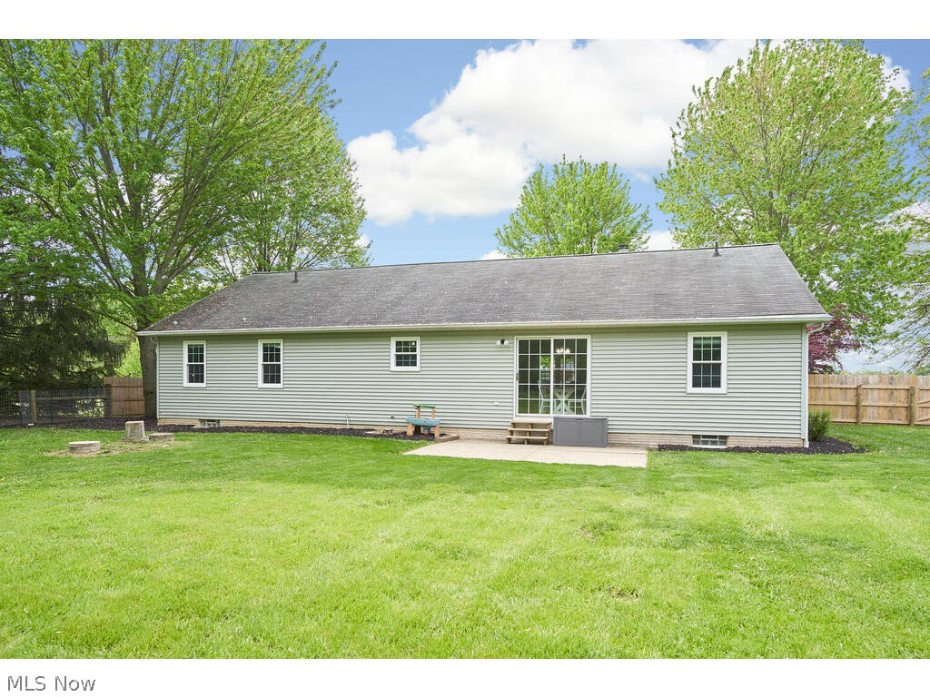 41780 Parsons Road Lagrange, OH 44050 - Photo 18 of 21 Back of house with a lawn and a patio