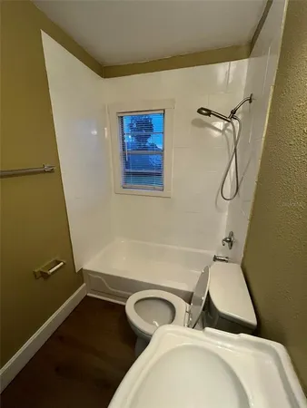 a view of a small space with wooden floor
