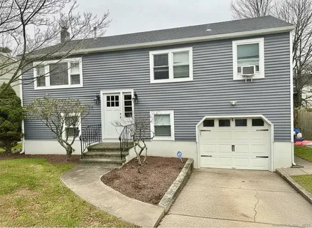 a view of a house with backyard