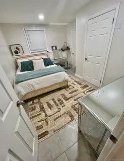 a bedroom with a bed and a cabinets