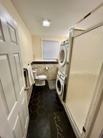 a utility room with dryer and washer