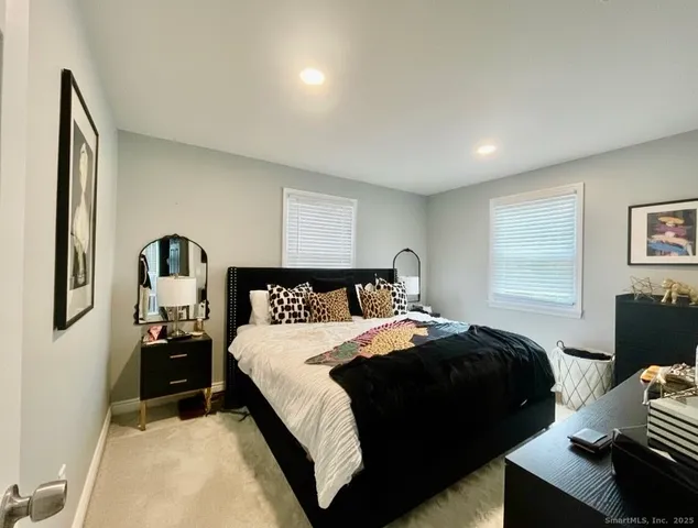 a bedroom with a bed and dresser
