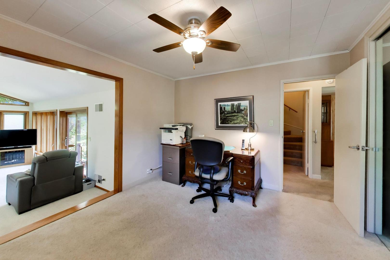 103 Cottonwood Road Northbrook, IL 60062 - Photo 18 of 50 a work room with furniture and a ceiling fan