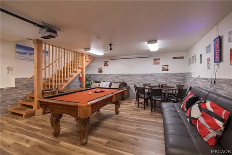 a room with furniture and air hockey table