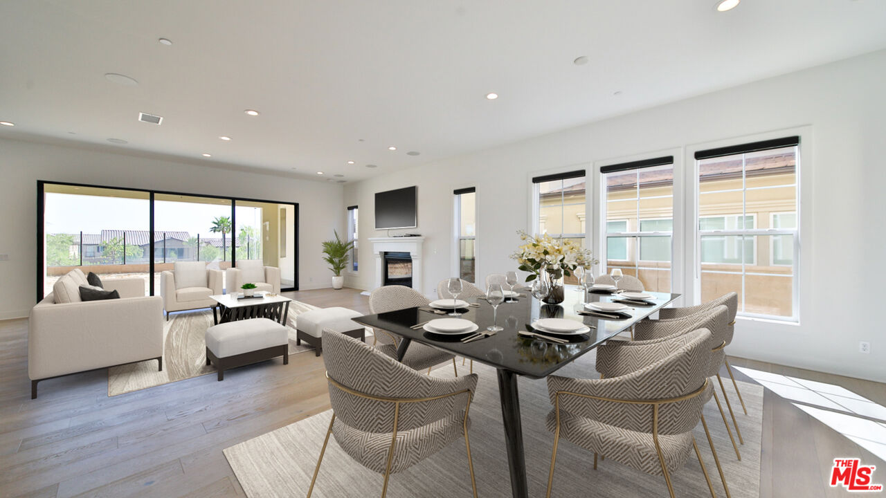 20618 West Wood Rose Court Porter Ranch, CA 91326 - Photo 1 of 44 a dining room with furniture and large windows