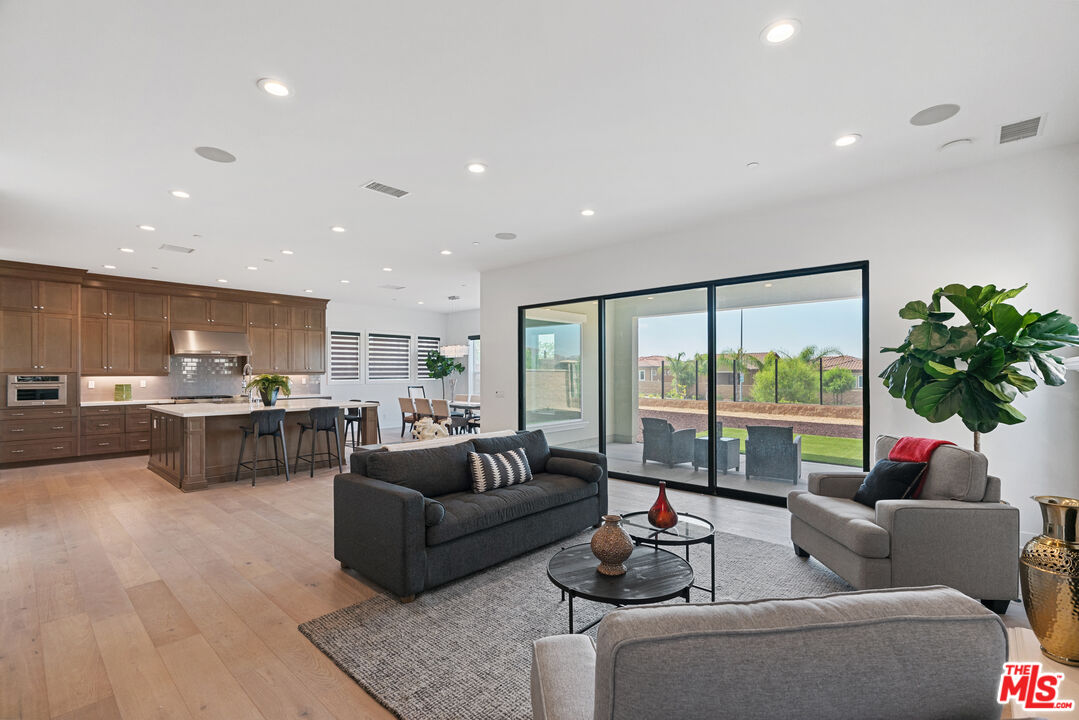 20618 West Wood Rose Court Porter Ranch, CA 91326 - Photo 12 of 44 a living room with furniture and a large window