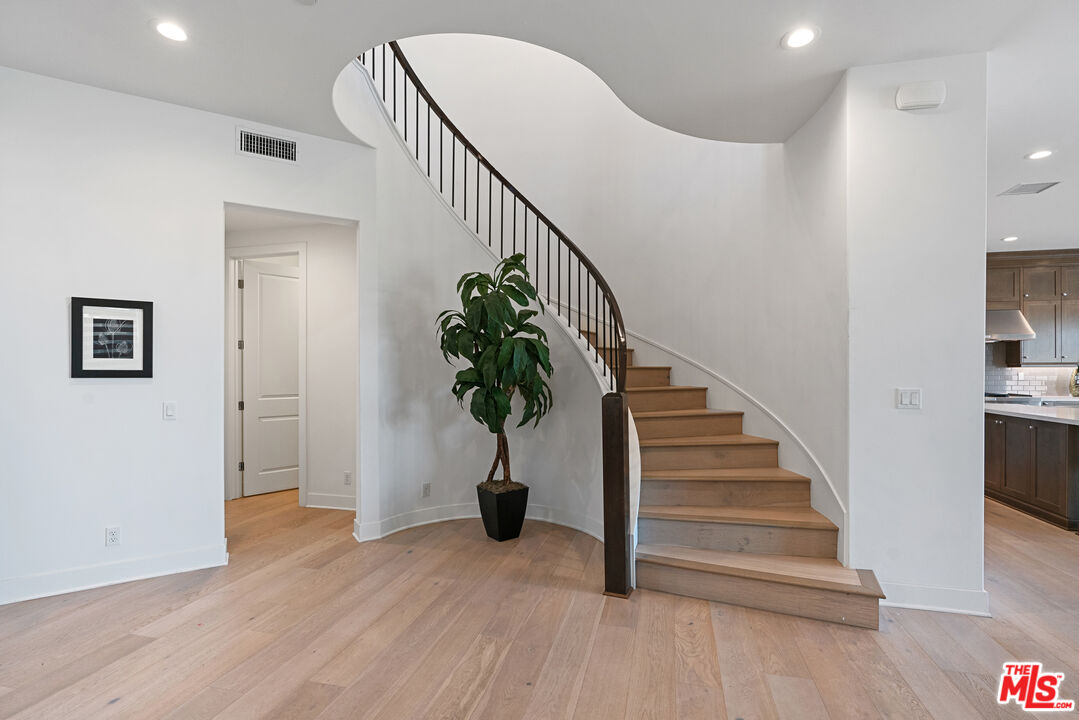 20618 West Wood Rose Court Porter Ranch, CA 91326 - Photo 19 of 44 a view of entryway and hall with wooden floor