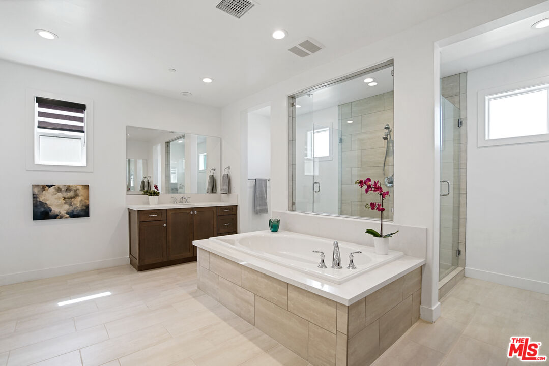 20618 West Wood Rose Court Porter Ranch, CA 91326 - Photo 26 of 44 a bathroom with a sink and a mirror