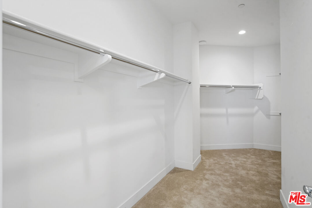20618 West Wood Rose Court Porter Ranch, CA 91326 - Photo 28 of 44 a view of an empty walk in closet