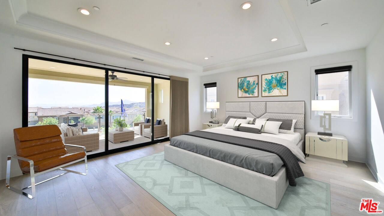 20618 West Wood Rose Court Porter Ranch, CA 91326 - Photo 3 of 44 a bedroom with a bed and glass walk in closet