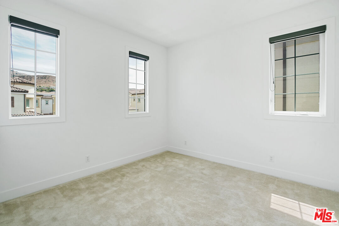 20618 West Wood Rose Court Porter Ranch, CA 91326 - Photo 35 of 44 an empty room with a window