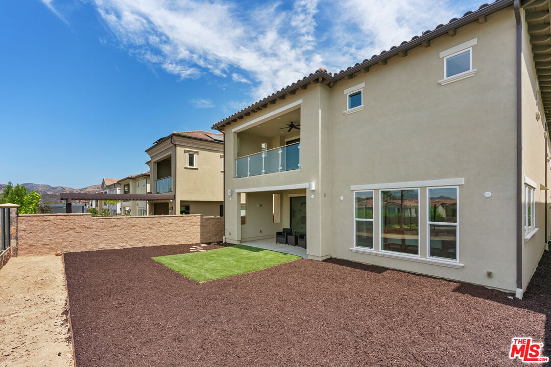 20618 West Wood Rose Court Porter Ranch, CA 91326 - Photo 36 of 44 a house with a yard